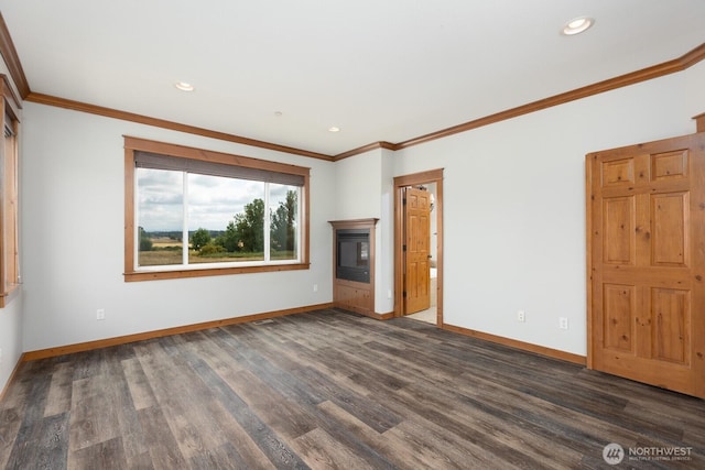 unfurnished living room featuring ornamental molding, recessed lighting, baseboards, and wood finished floors