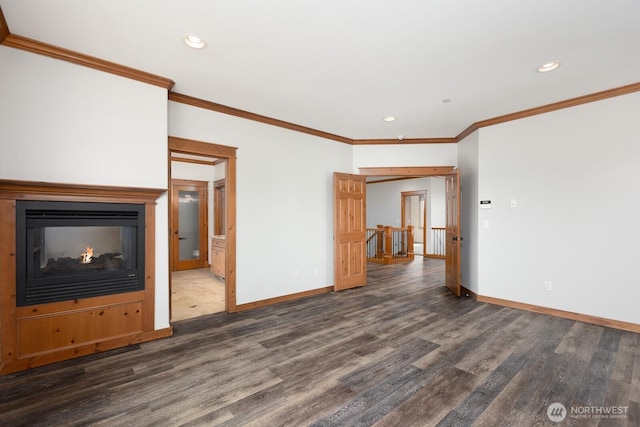 unfurnished living room with recessed lighting, wood finished floors, and baseboards