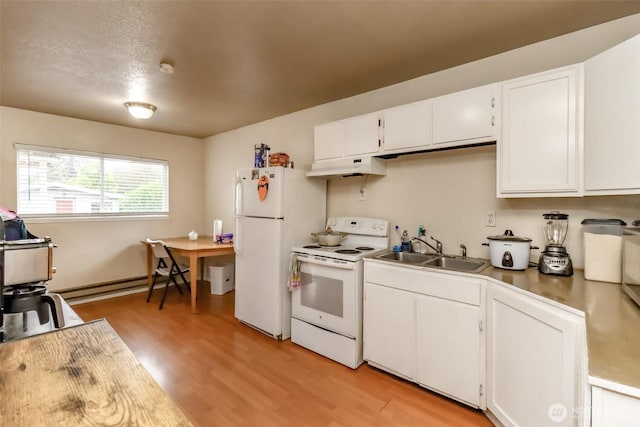 kitchen featuring white appliances, white cabinets, a baseboard radiator, under cabinet range hood, and a sink