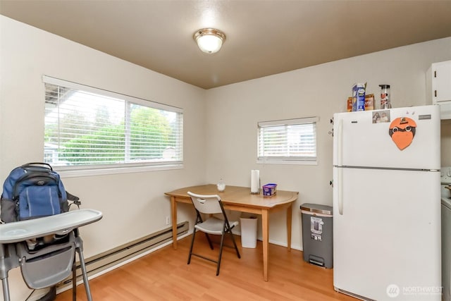 office area with a healthy amount of sunlight and light wood-style flooring