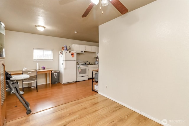 interior space with white appliances, baseboards, ceiling fan, light wood-style floors, and white cabinetry