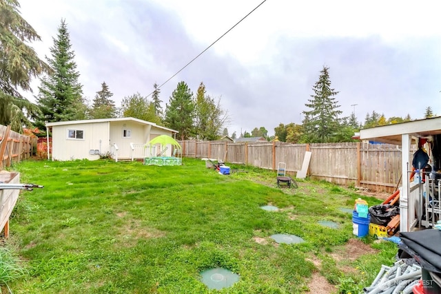 view of yard with a fenced backyard