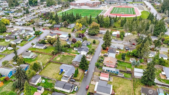 birds eye view of property with a residential view