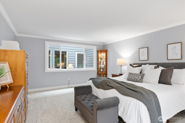 bedroom featuring carpet, baseboards, and crown molding