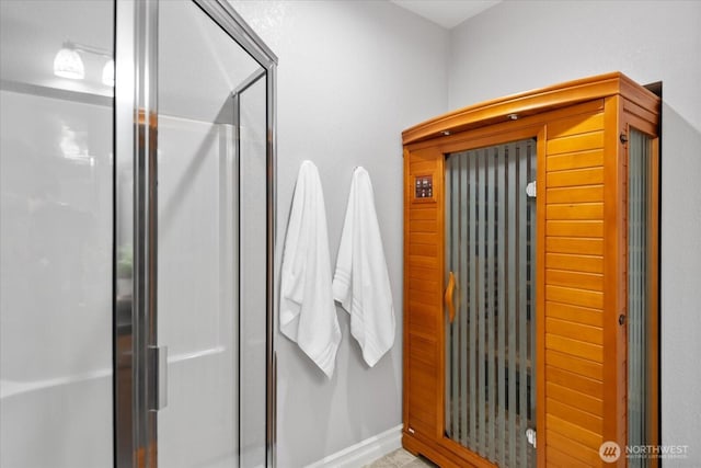 bathroom featuring a stall shower and a sauna