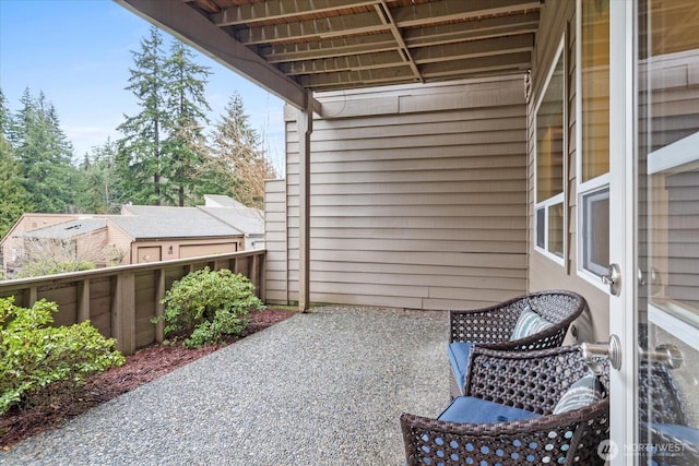 view of patio featuring a balcony