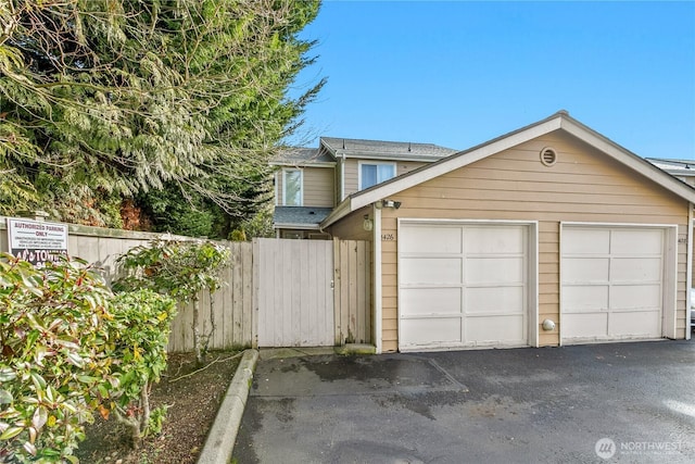 garage with fence