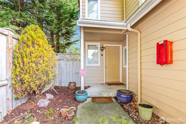 doorway to property with fence