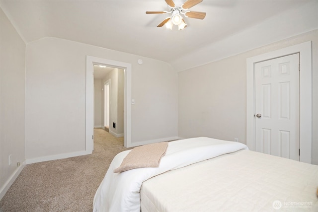 bedroom featuring lofted ceiling, carpet, a ceiling fan, and baseboards