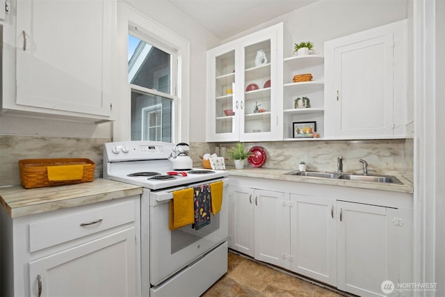 kitchen with a sink, white cabinets, decorative backsplash, and white range with electric cooktop