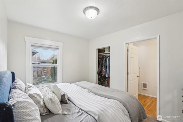 bedroom featuring a closet and wood finished floors