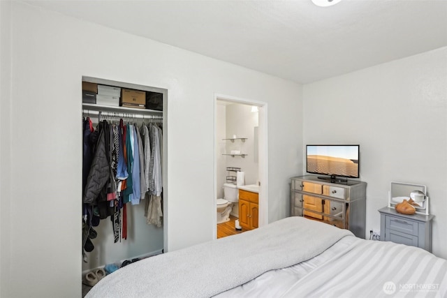 bedroom with a closet and connected bathroom