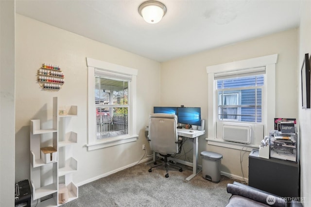 home office with baseboards and carpet floors