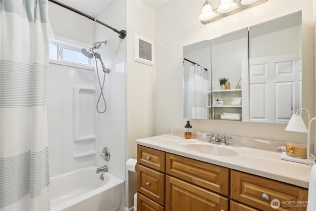 bathroom with vanity, shower / bath combo, and visible vents