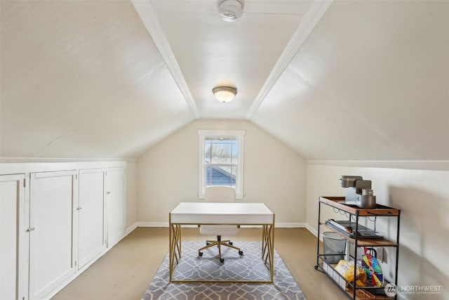 office space featuring baseboards and vaulted ceiling