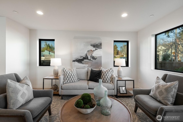 living room with recessed lighting, baseboards, and wood finished floors