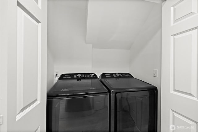 clothes washing area with washing machine and dryer and laundry area