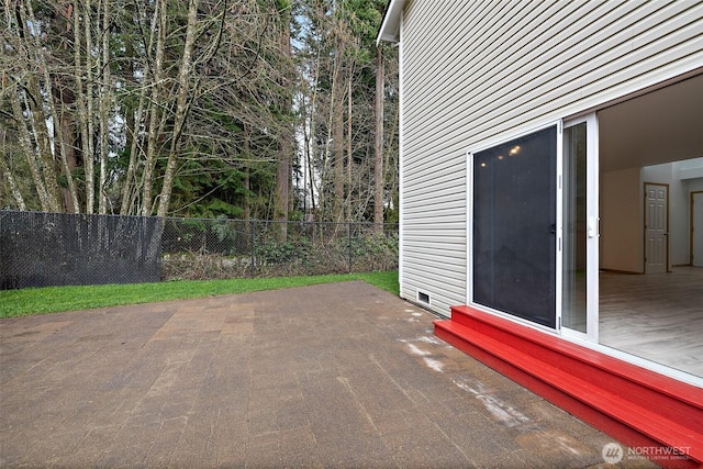 view of patio featuring entry steps and fence