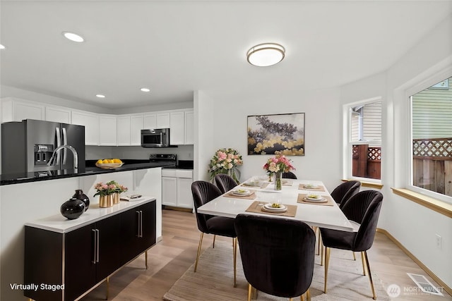 dining area featuring recessed lighting, visible vents, light wood finished floors, and baseboards