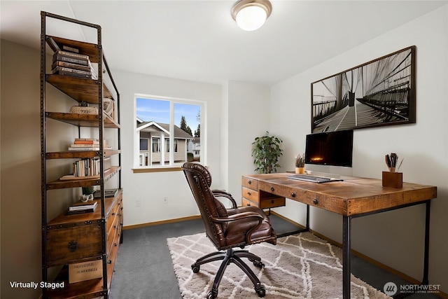 office with baseboards and carpet floors