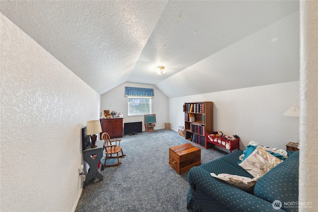 sitting room featuring lofted ceiling, a textured wall, a textured ceiling, and carpet