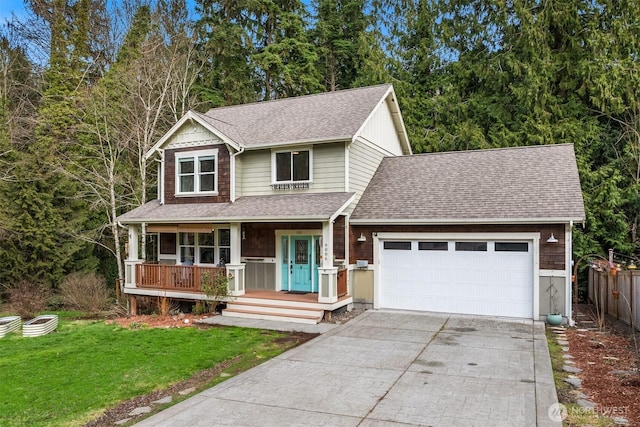 view of front of house with covered porch, a garage, driveway, roof with shingles, and a front lawn