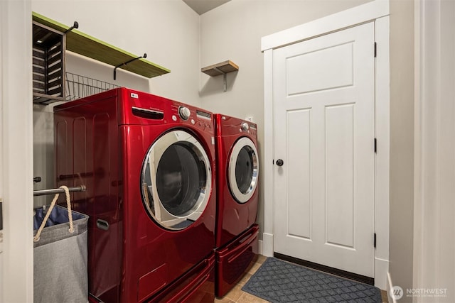 laundry room featuring laundry area, tile patterned floors, and washer and dryer