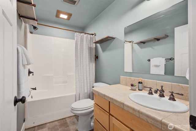 full bathroom featuring toilet, shower / tub combo with curtain, and vanity