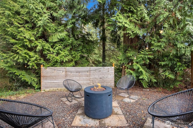 view of patio / terrace with an outdoor fire pit