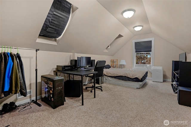 bedroom with vaulted ceiling, carpet flooring, and baseboards