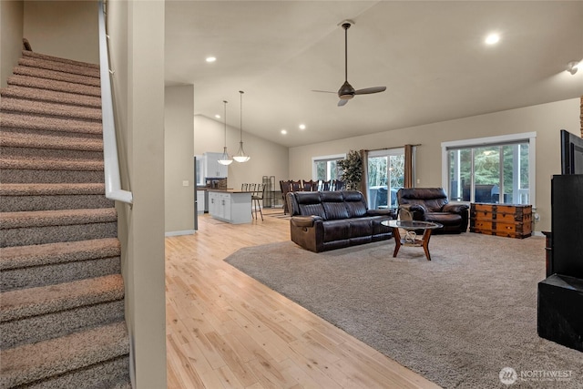 living room featuring stairs, recessed lighting, a ceiling fan, and light wood-type flooring