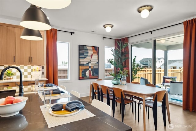 dining area featuring baseboards