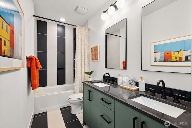 bathroom featuring tile patterned flooring, a sink, shower / bathtub combination with curtain, and toilet