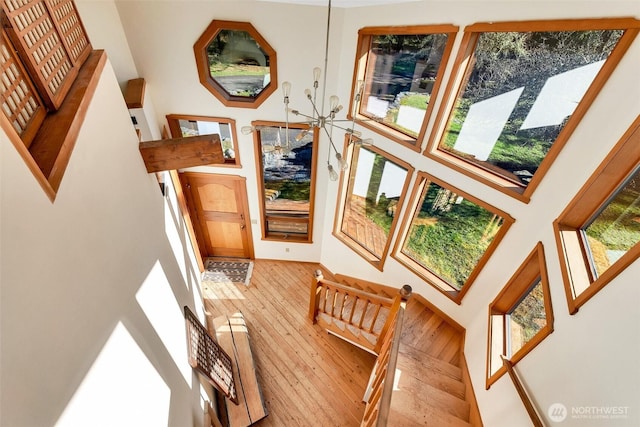 foyer entrance with stairway and hardwood / wood-style flooring