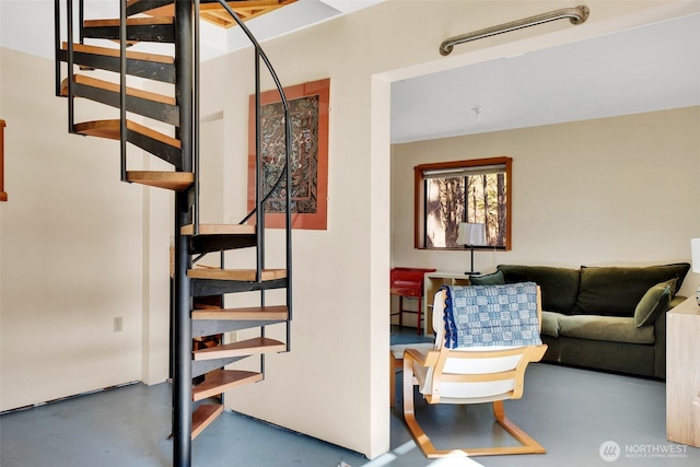 staircase with finished concrete floors