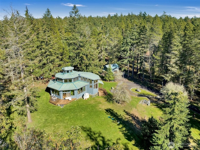 birds eye view of property with a wooded view