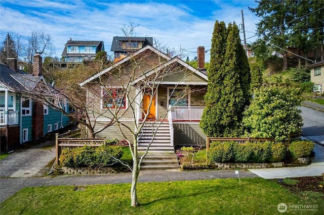 view of front facade featuring stairs and a porch