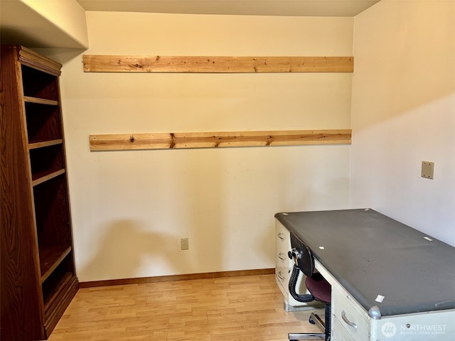 interior space with light wood-style flooring and baseboards