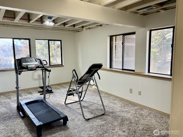 workout room with carpet flooring and baseboards