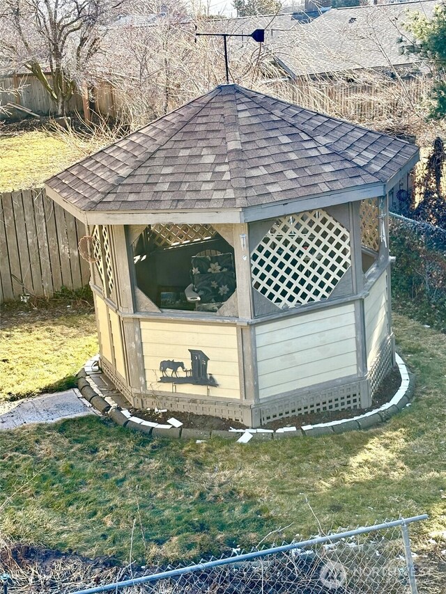 view of outbuilding featuring a gazebo and fence