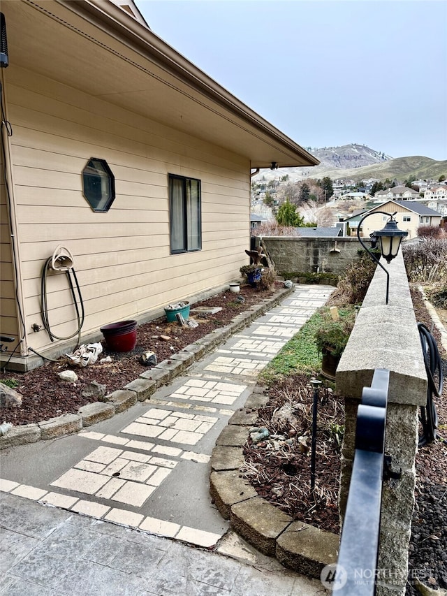 view of side of property with a mountain view