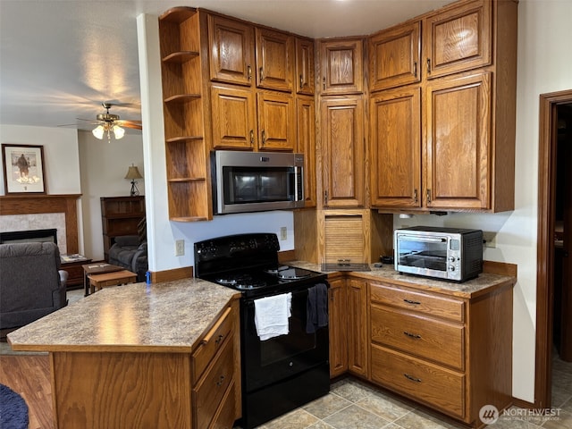 kitchen with a ceiling fan, stainless steel microwave, open shelves, black range with electric stovetop, and brown cabinets