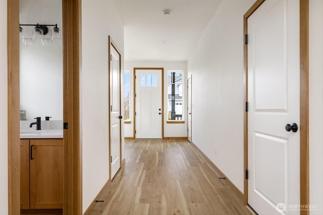 corridor featuring light wood-type flooring