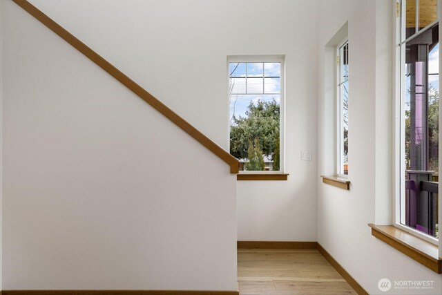 interior space featuring baseboards and wood finished floors