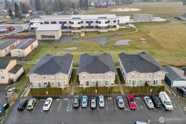 birds eye view of property with a residential view