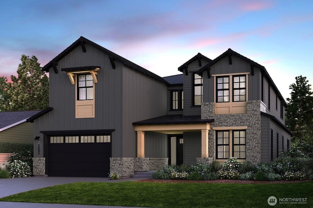 modern inspired farmhouse featuring a garage, brick siding, driveway, board and batten siding, and a front yard