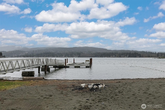 dock area featuring a water and mountain view