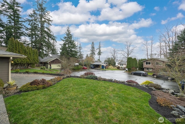 view of yard featuring a residential view