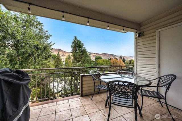 balcony featuring a grill and a mountain view