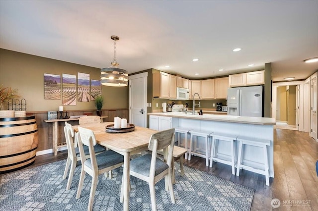 dining area featuring recessed lighting and wood finished floors